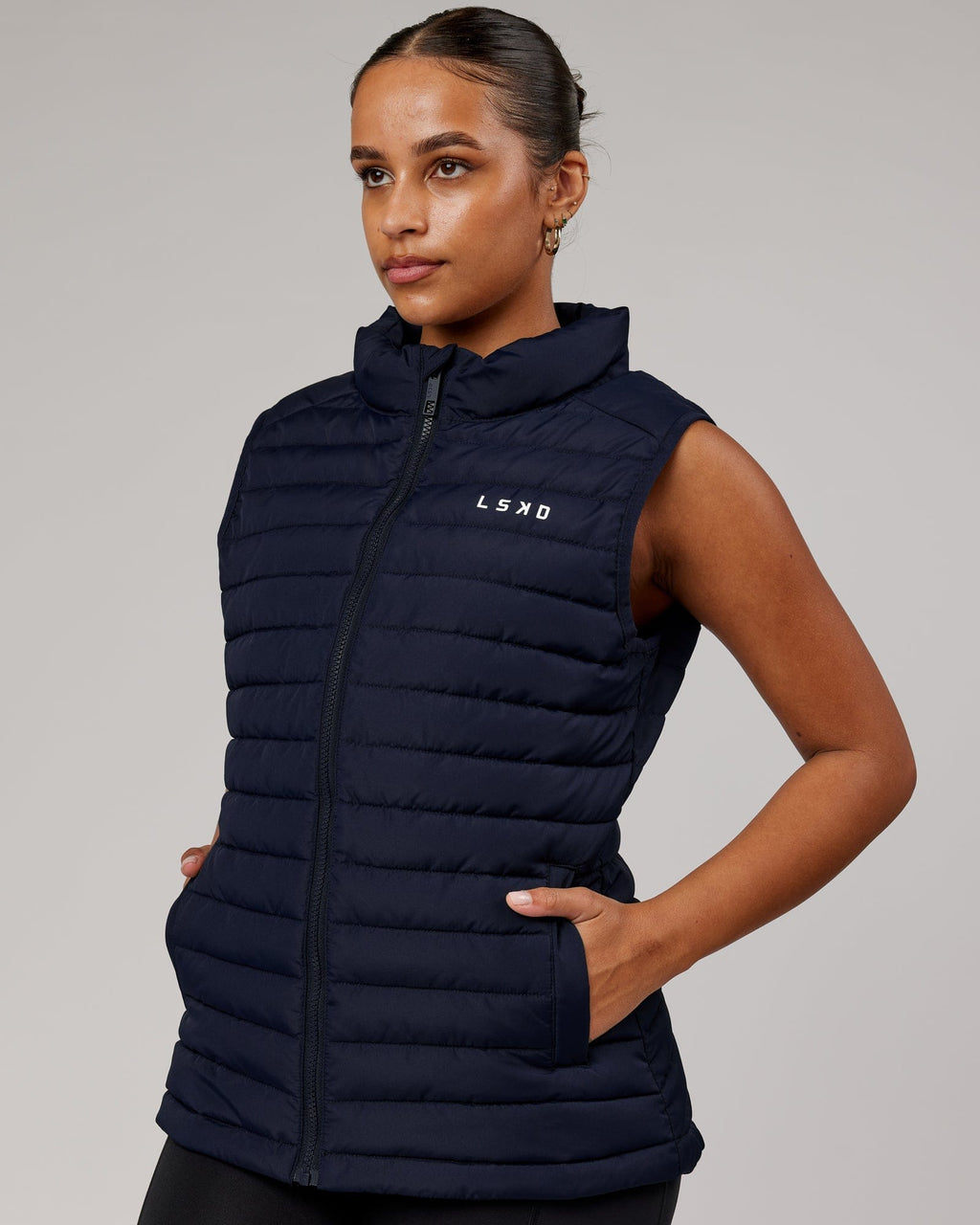 Model wearing Uplift Puffer Vest - Navy