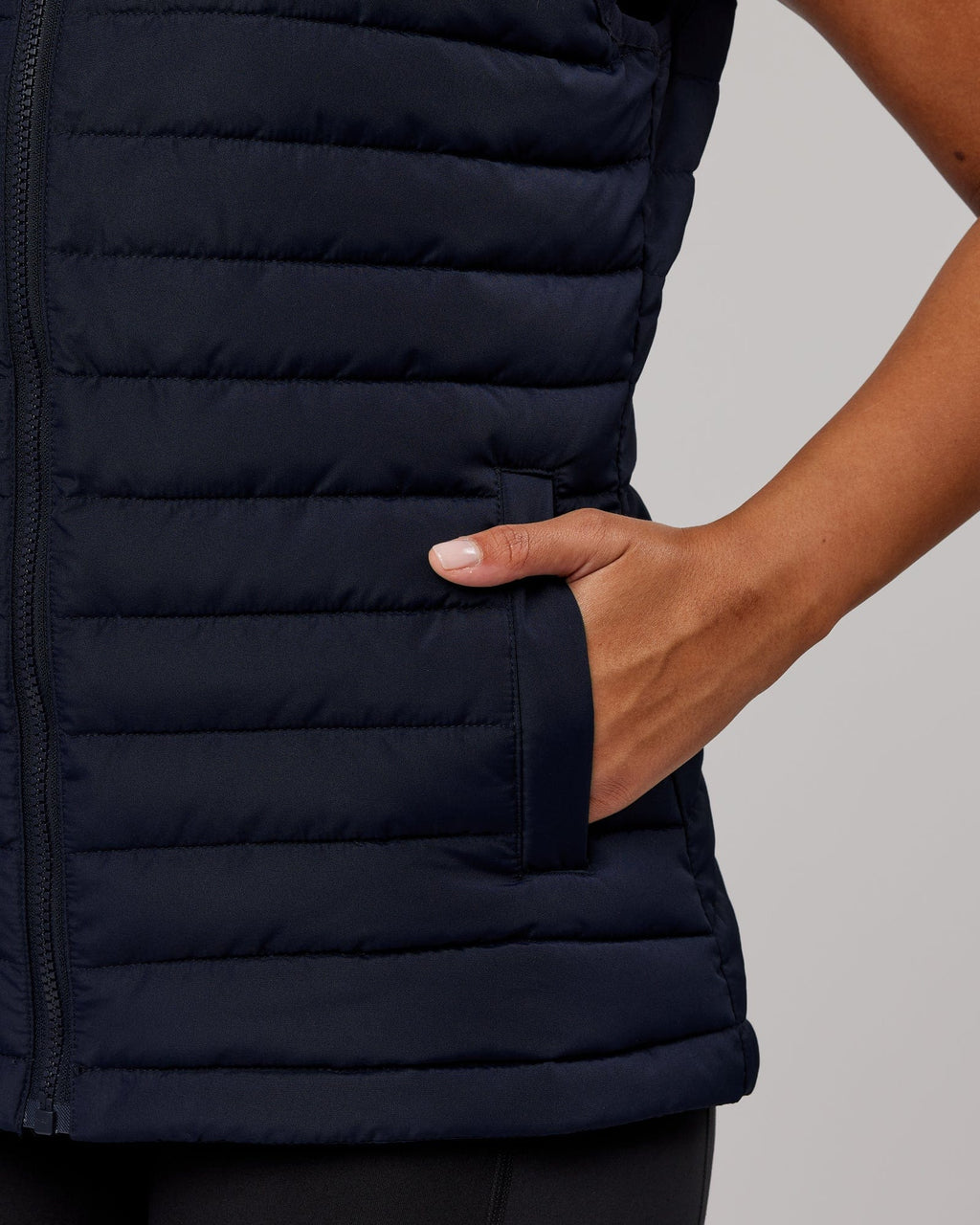 Model wearing Uplift Puffer Vest - Navy
