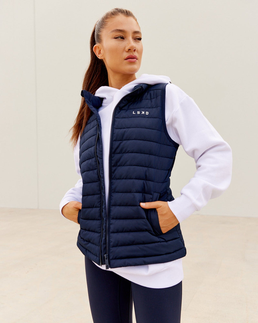 Model wearing Uplift Puffer Vest - Navy