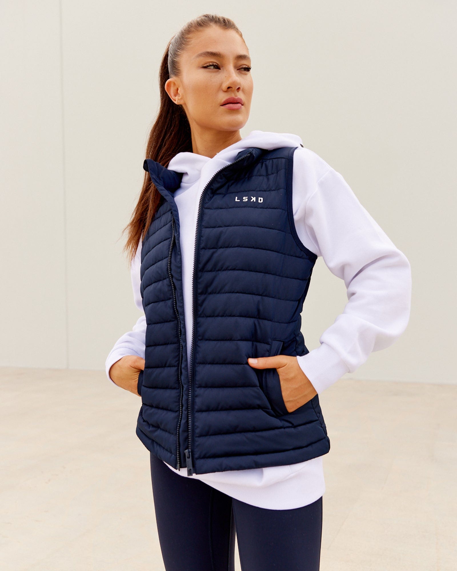 Model wearing Uplift Puffer Vest - Navy