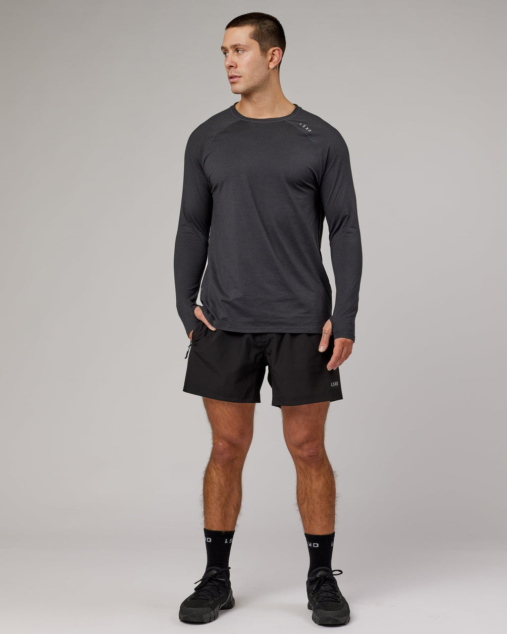 Model wearing Perform VapourFLX LS Tee - Black Marl