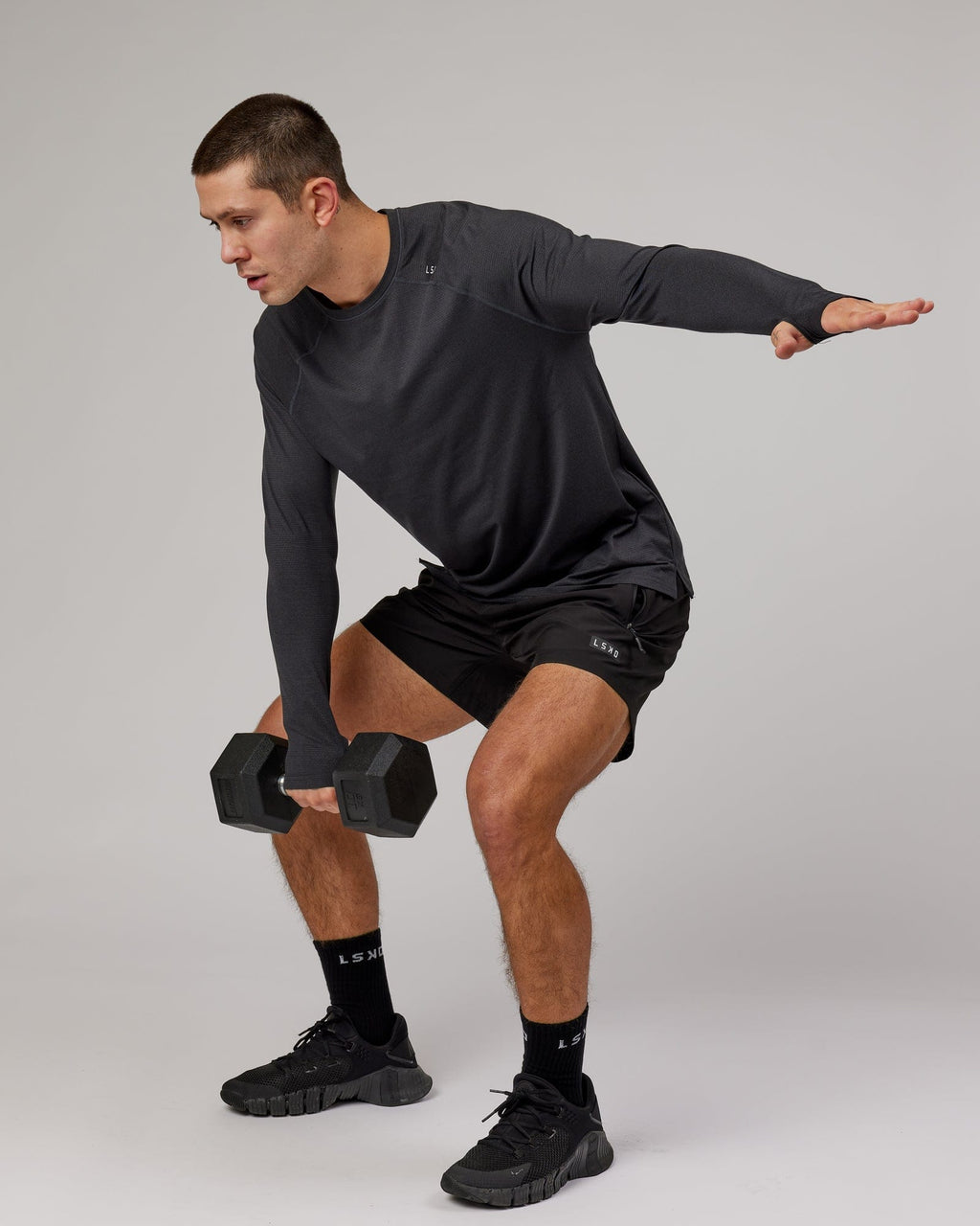 Model wearing Perform VapourFLX LS Tee - Black Marl