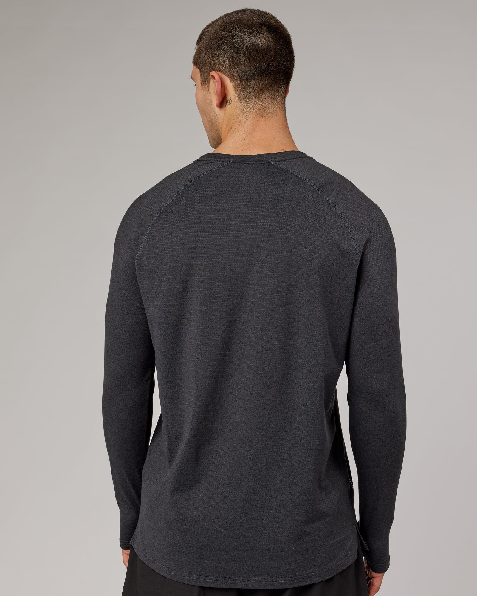 Model wearing Perform VapourFLX LS Tee - Black Marl
