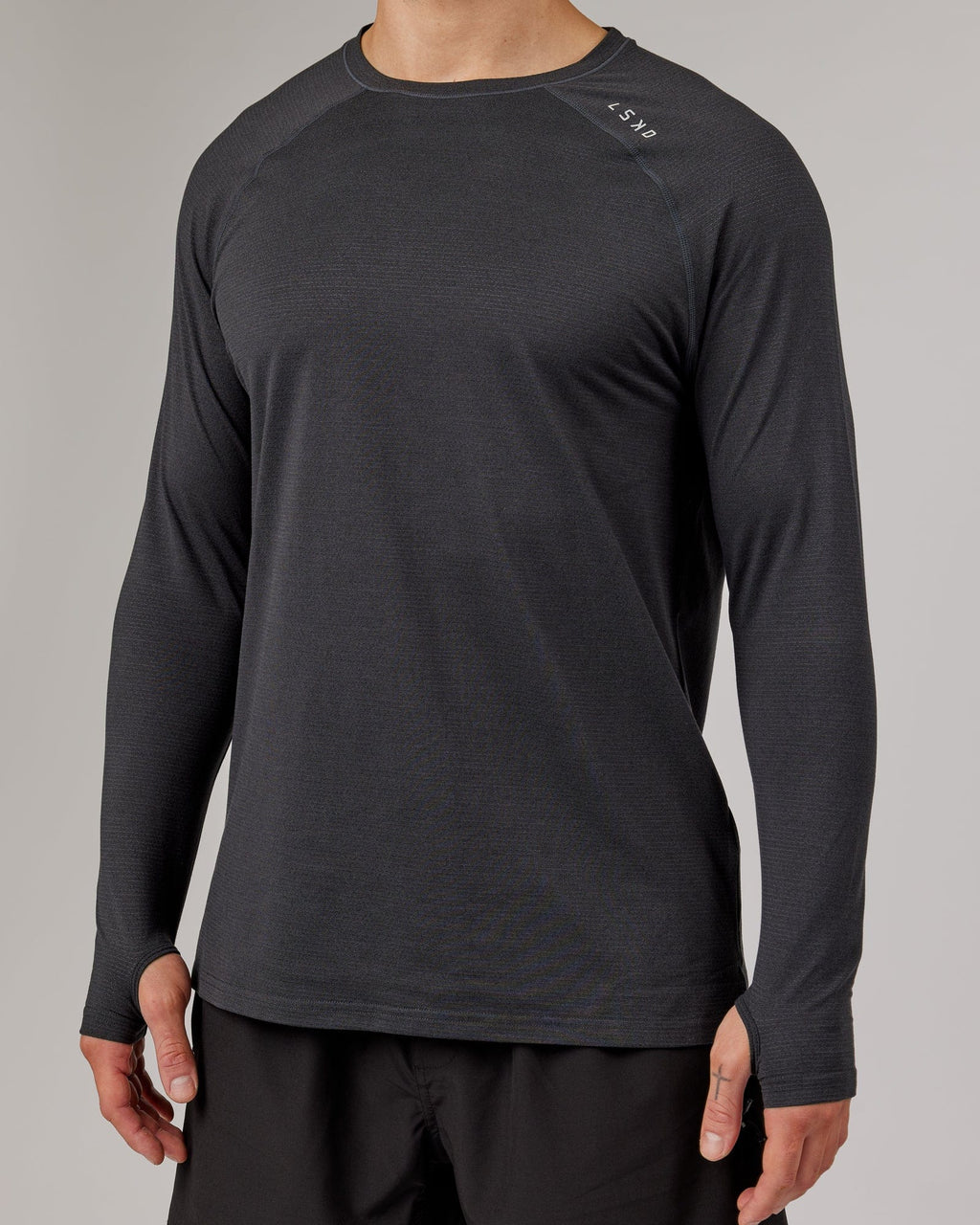 Model wearing Perform VapourFLX LS Tee - Black Marl