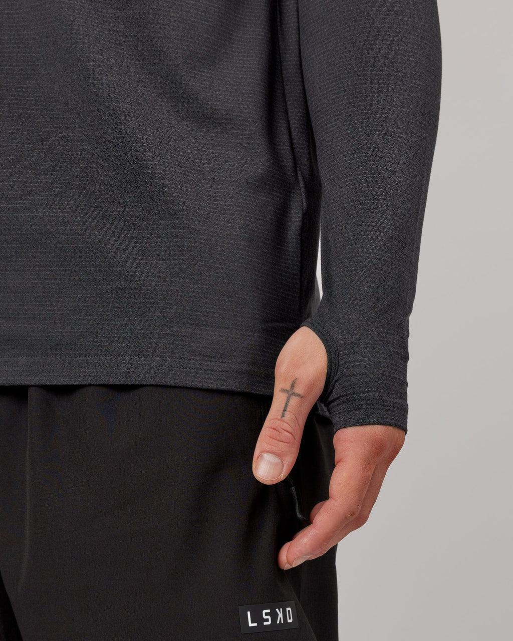Model wearing Perform VapourFLX LS Tee - Black Marl