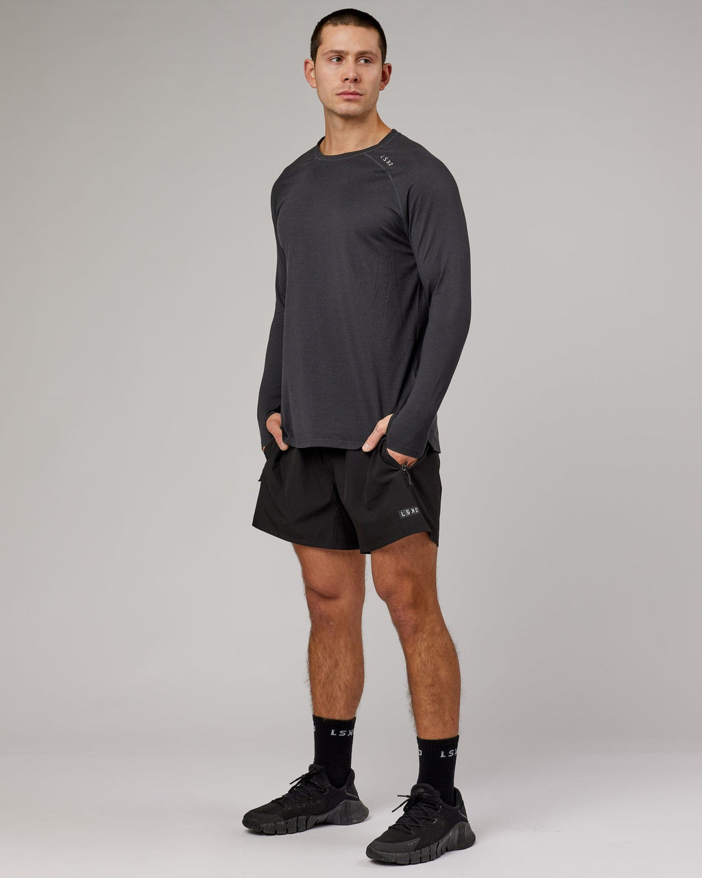 Model wearing Perform VapourFLX LS Tee - Black Marl