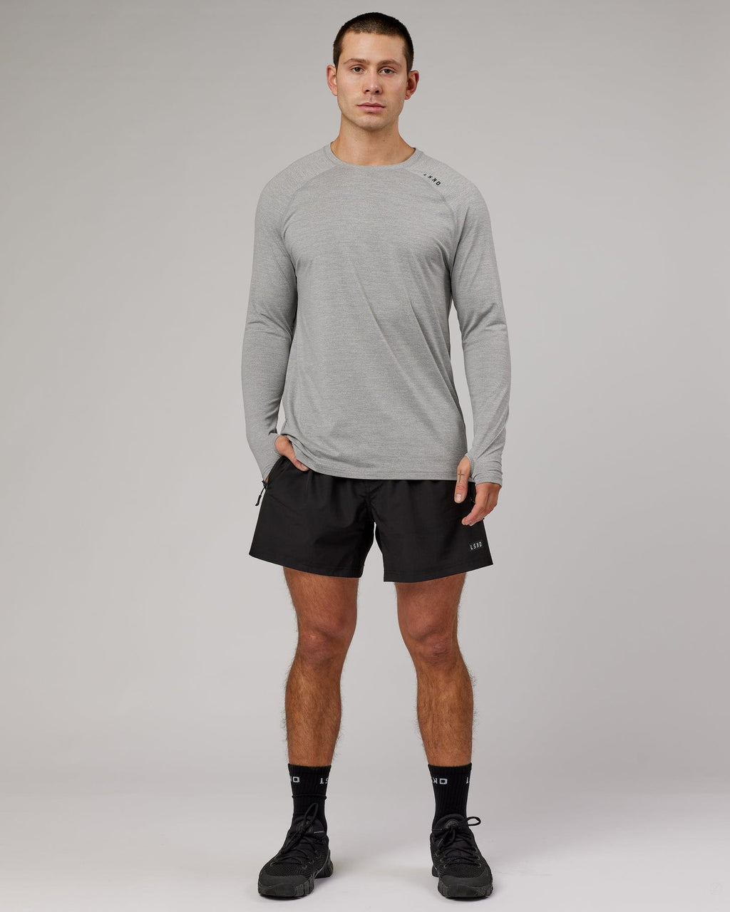 Model wearing Perform VapourFLX LS Tee - Lt Grey Marl