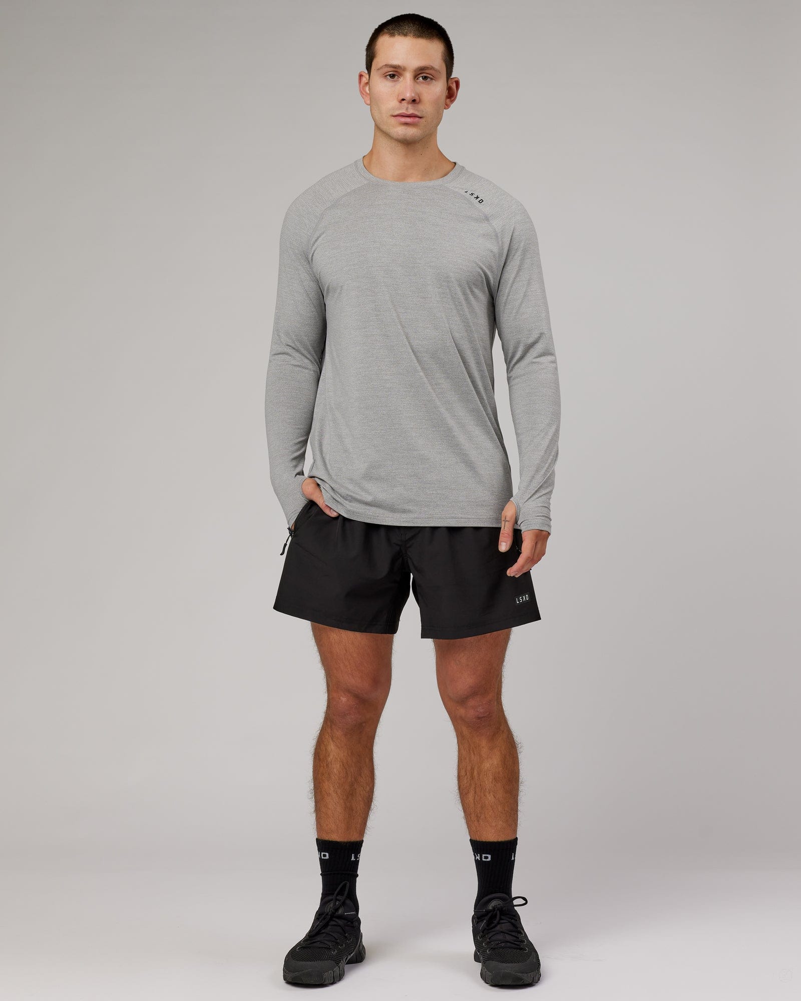 Model wearing Perform VapourFLX LS Tee - Lt Grey Marl