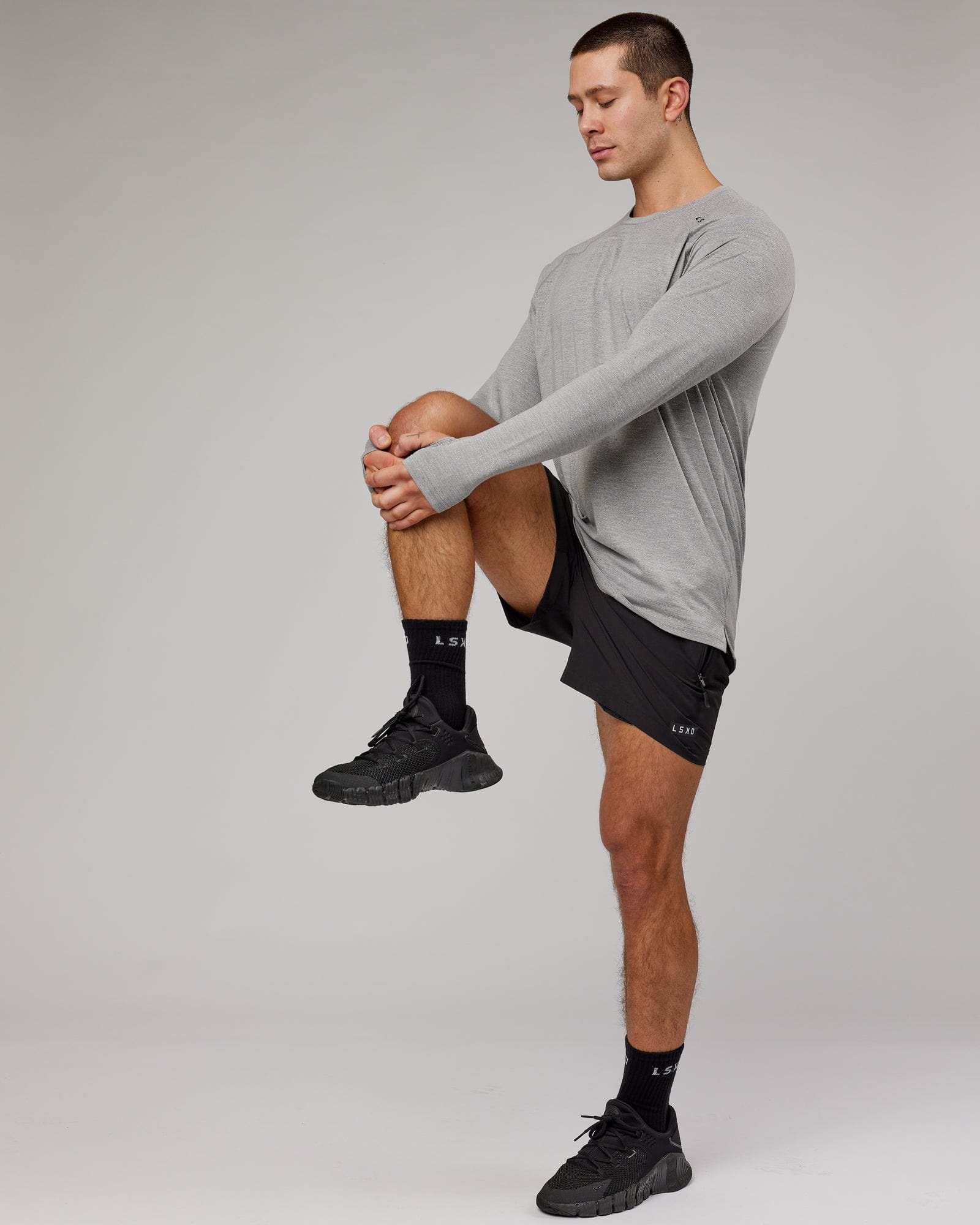 Model wearing Perform VapourFLX LS Tee - Lt Grey Marl