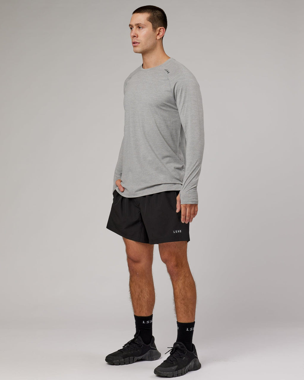 Model wearing Perform VapourFLX LS Tee - Lt Grey Marl