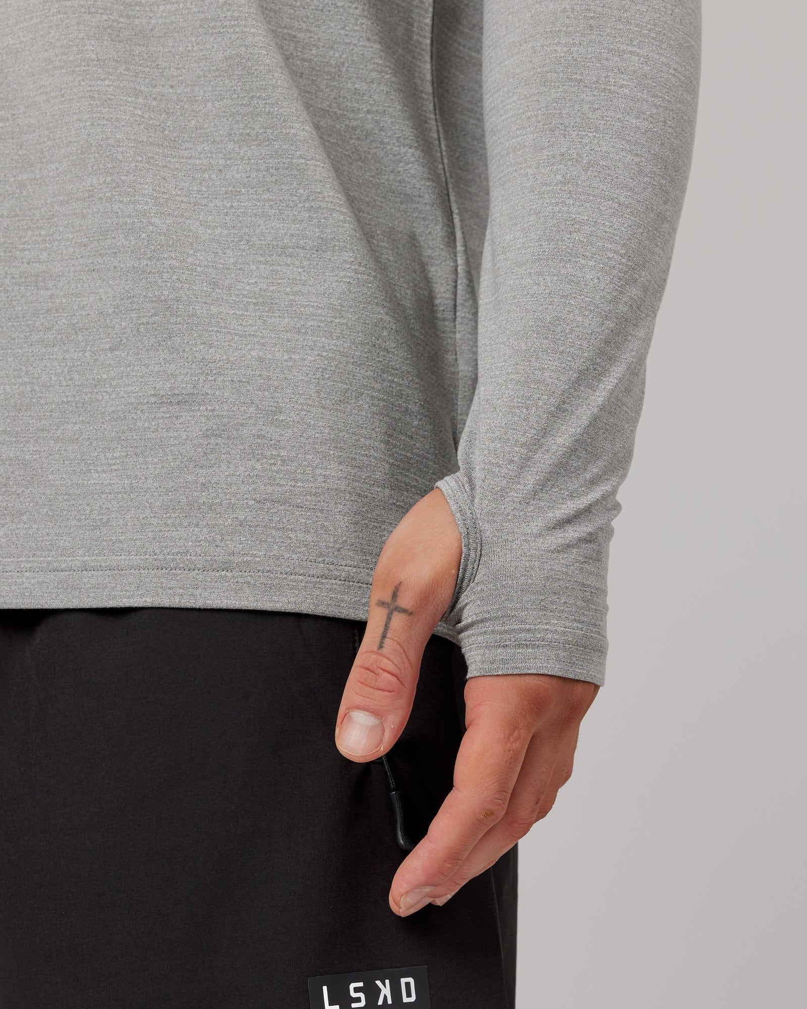 Model wearing Perform VapourFLX LS Tee - Lt Grey Marl