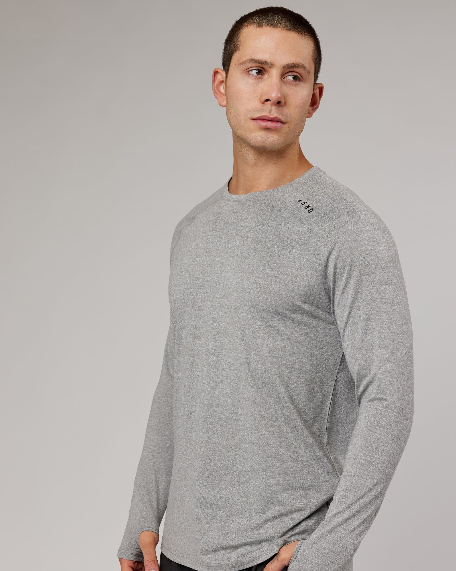 Model wearing Perform VapourFLX LS Tee - Lt Grey Marl