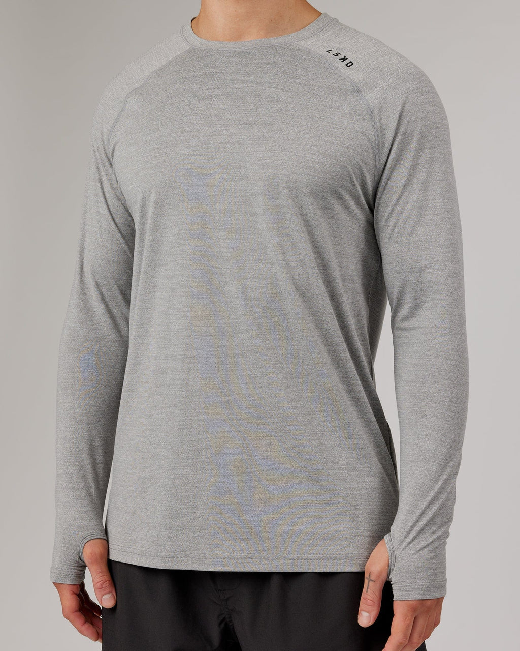 Model wearing Perform VapourFLX LS Tee - Lt Grey Marl