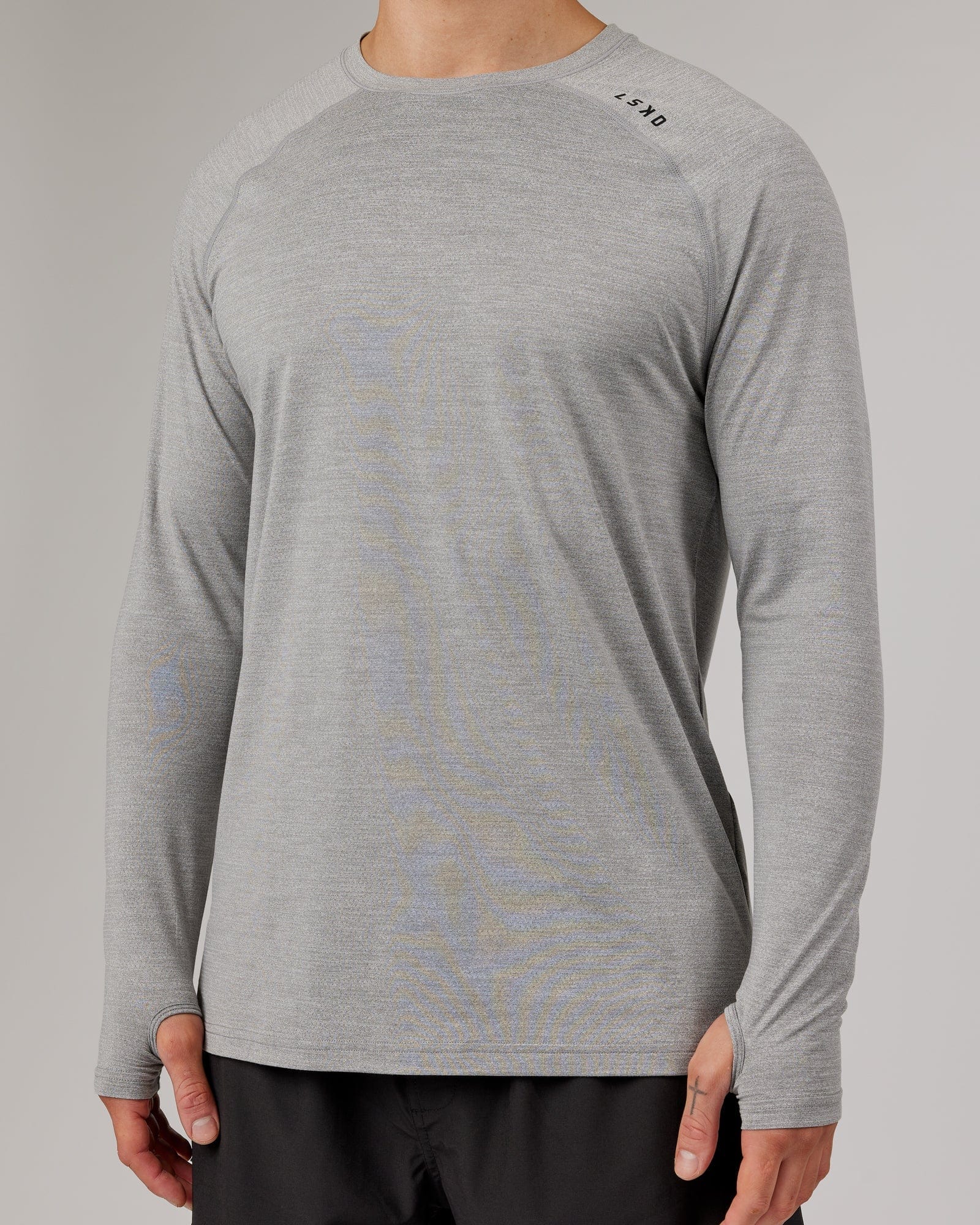Model wearing Perform VapourFLX LS Tee - Lt Grey Marl