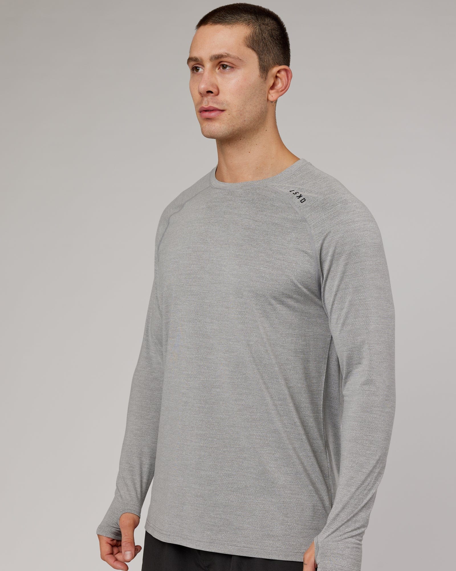 Model wearing Perform VapourFLX LS Tee - Lt Grey Marl