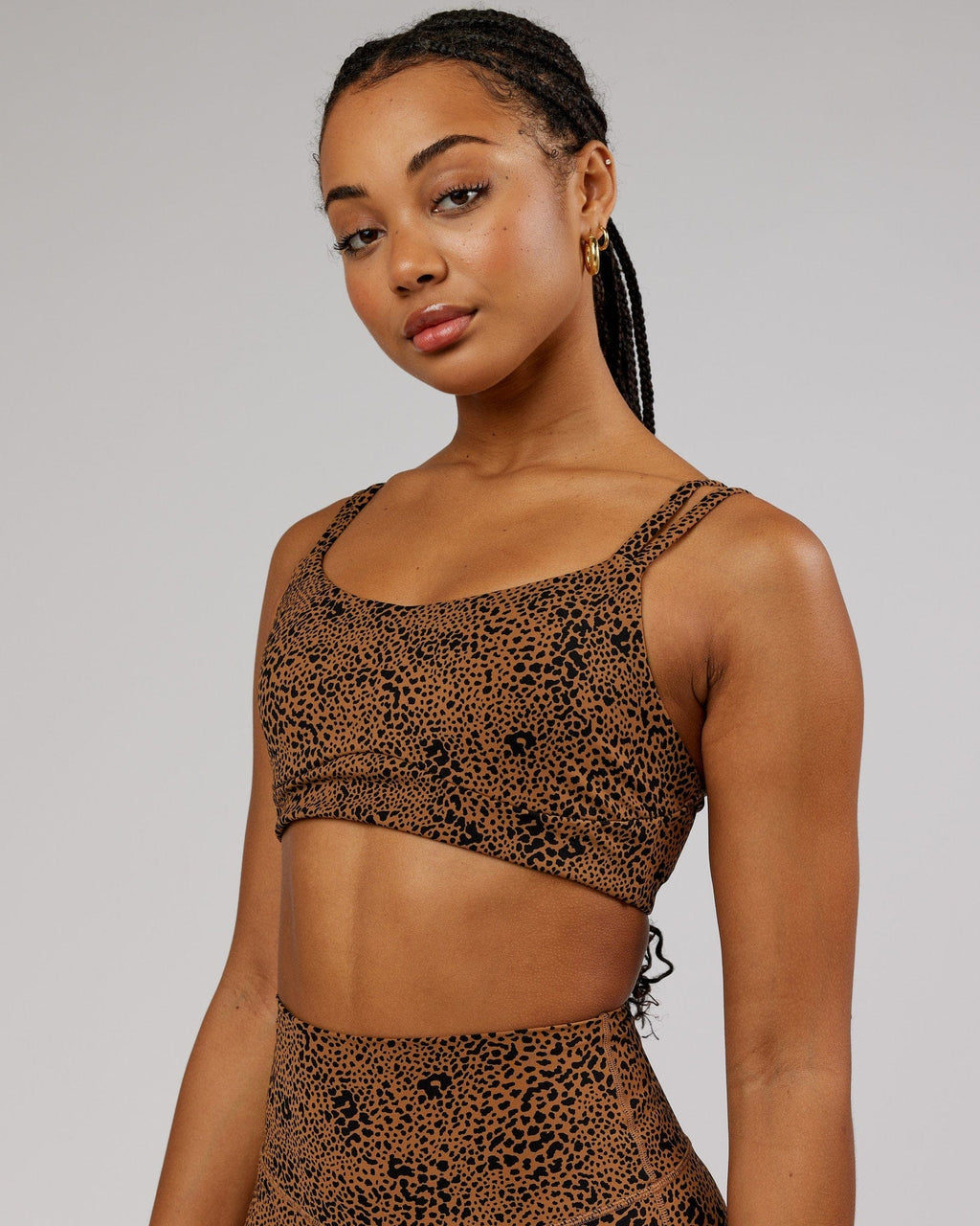 Model wearing Vogue Sports Bra - Agile Camel Print
