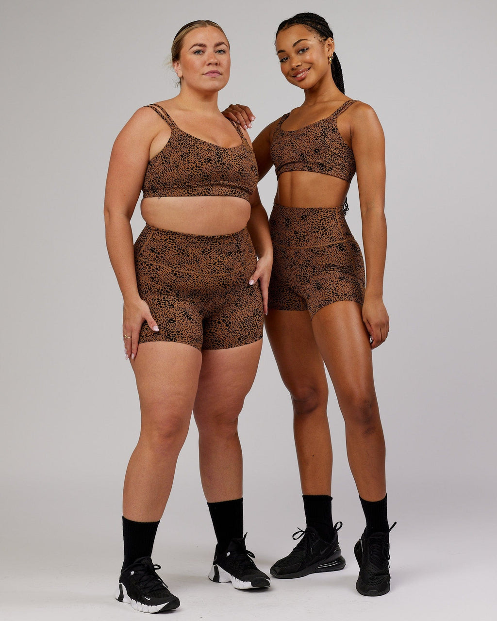 Model wearing Vogue Sports Bra - Agile Camel Print