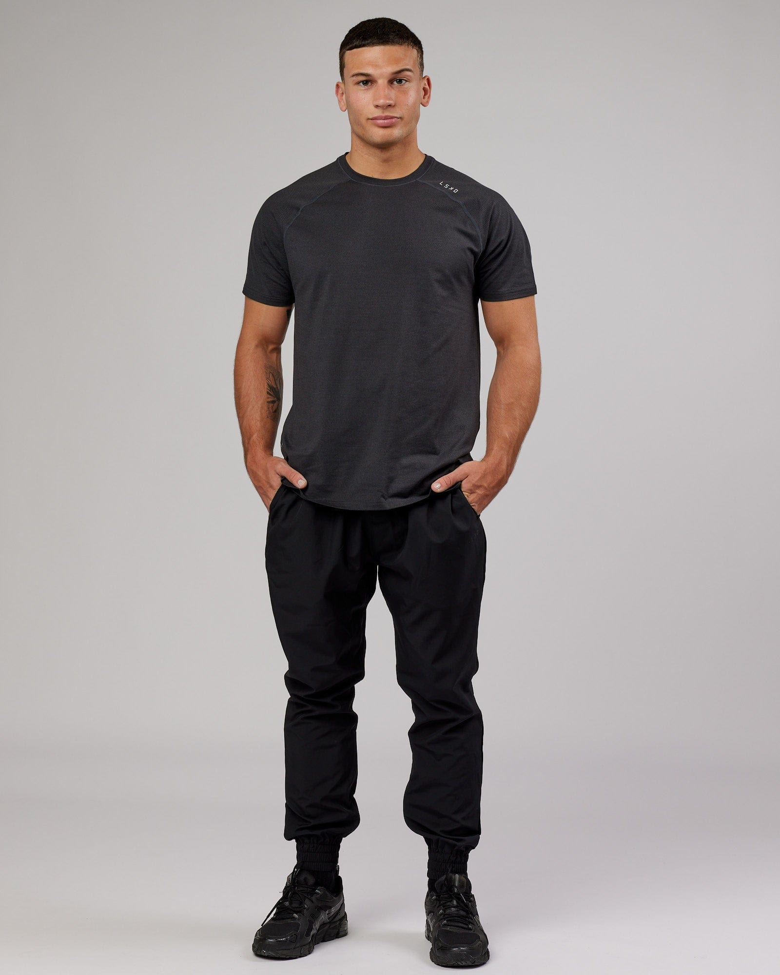 Model wearing Warm Up Zip Cuff Performance Jogger - Black