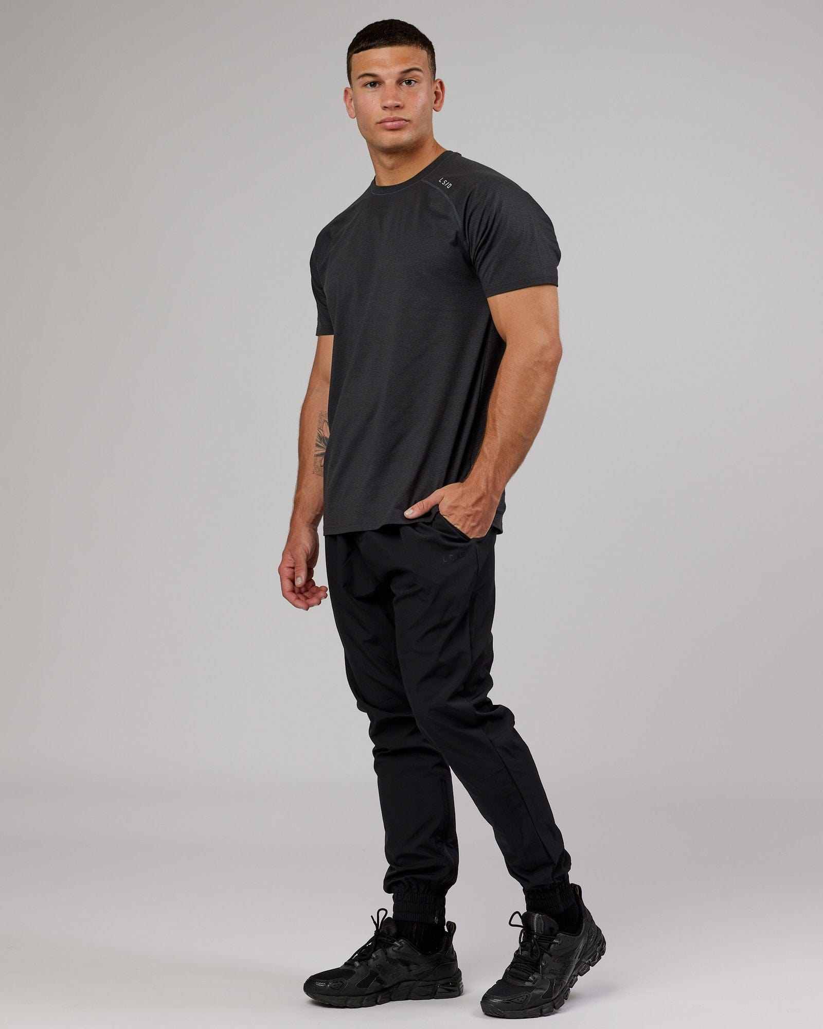 Model wearing Warm Up Zip Cuff Performance Jogger - Black
