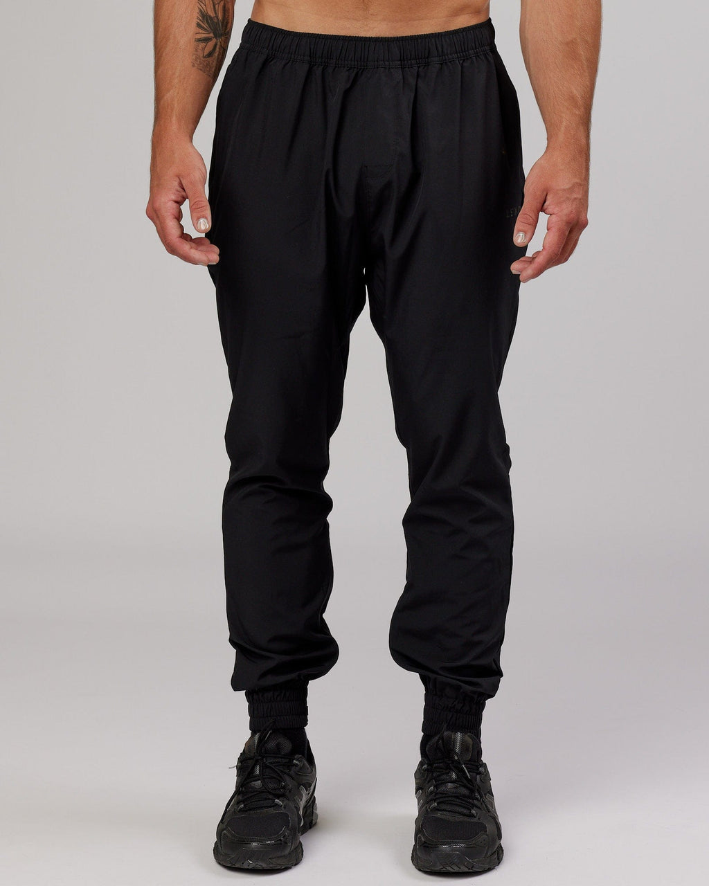 Model wearing Warm Up Zip Cuff Performance Jogger - Black