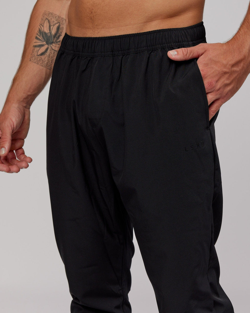 Model wearing Warm Up Zip Cuff Performance Jogger - Black