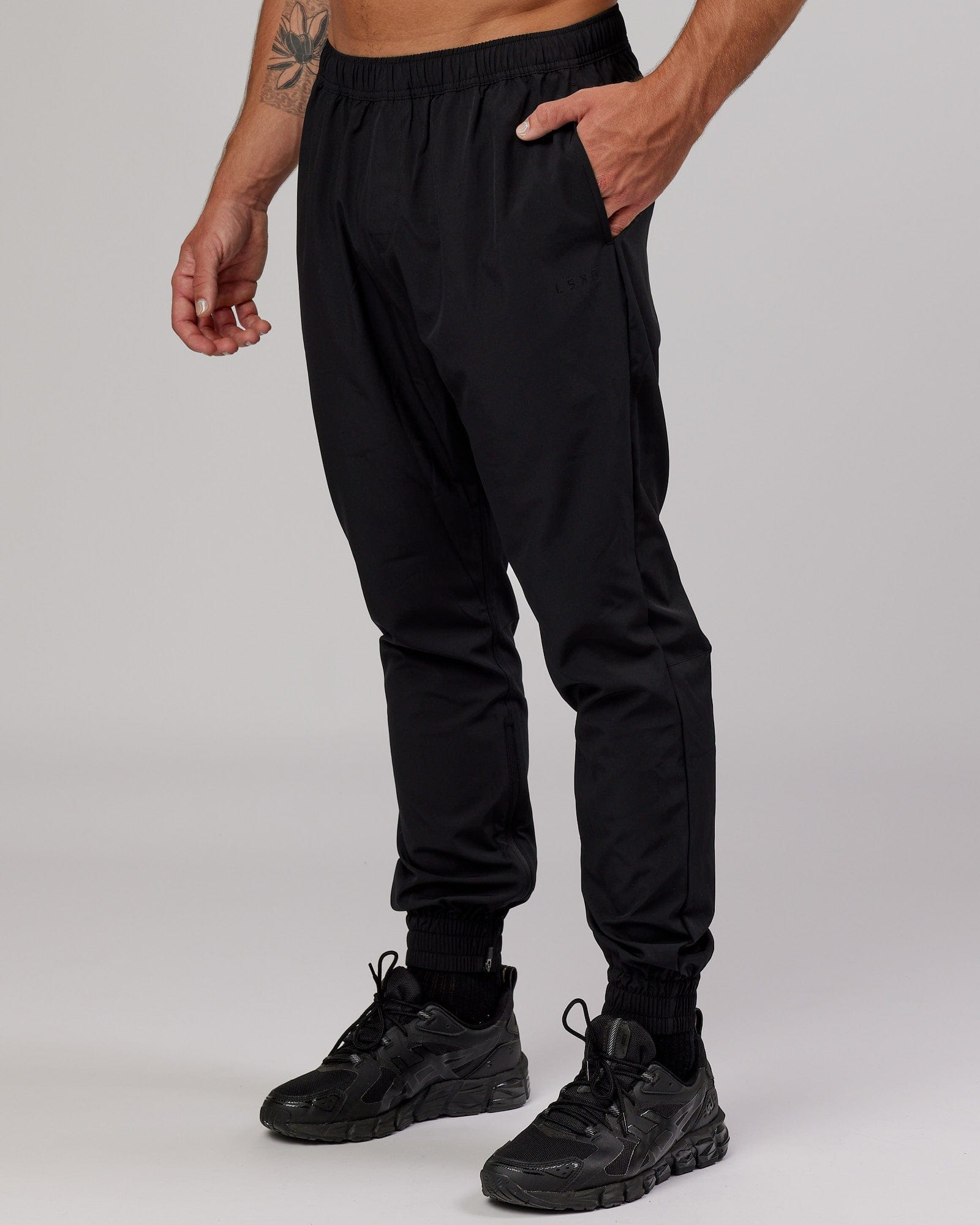 Model wearing Warm Up Zip Cuff Performance Jogger - Black