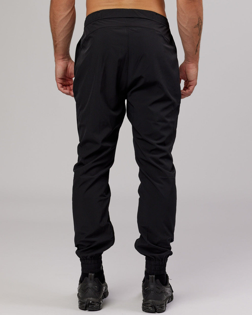 Model wearing Warm Up Zip Cuff Performance Jogger - Black