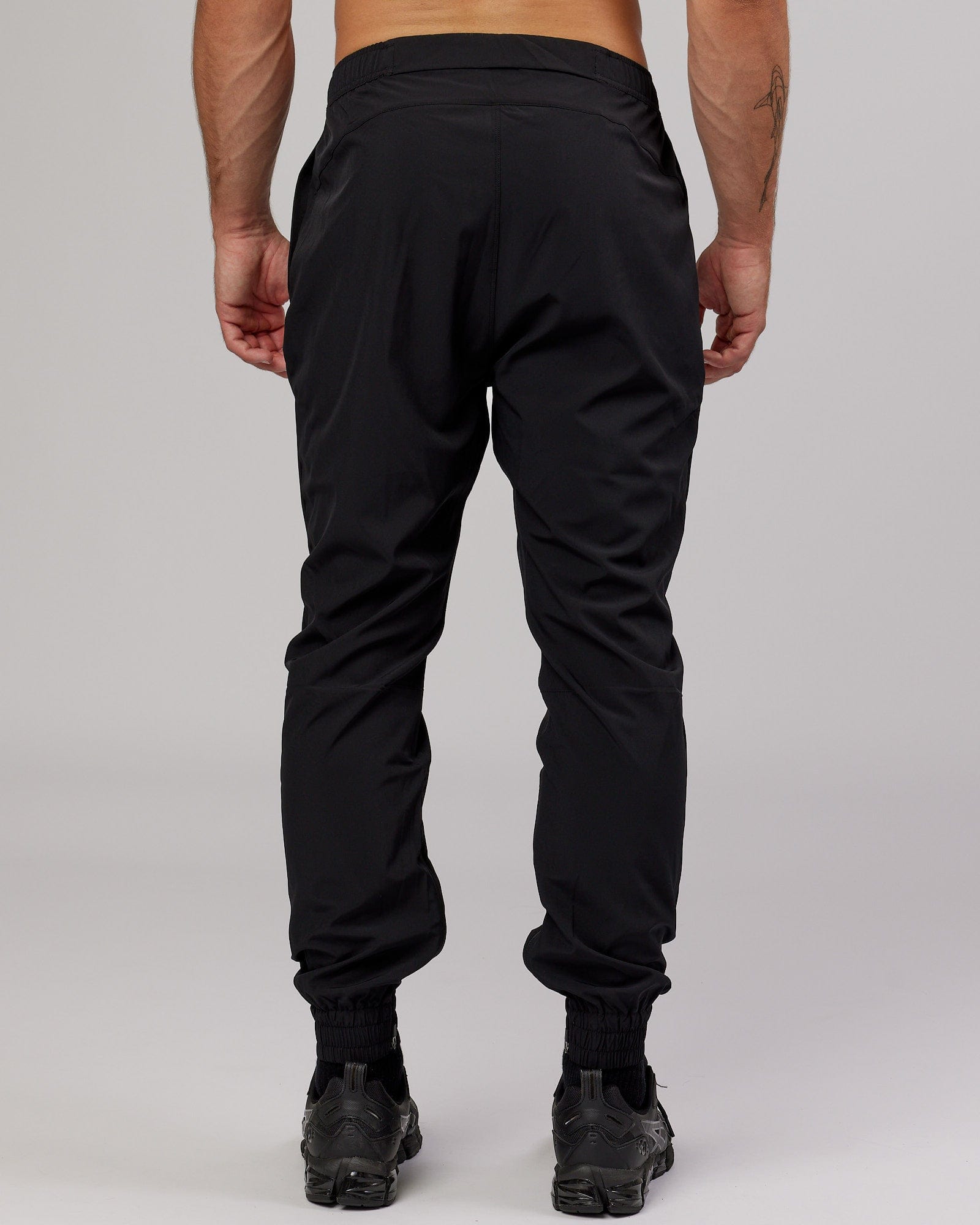 Model wearing Warm Up Zip Cuff Performance Jogger - Black