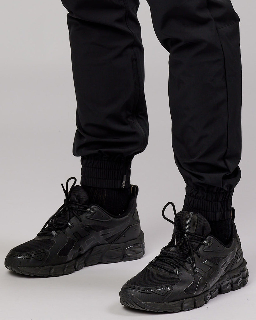 Model wearing Warm Up Zip Cuff Performance Jogger - Black