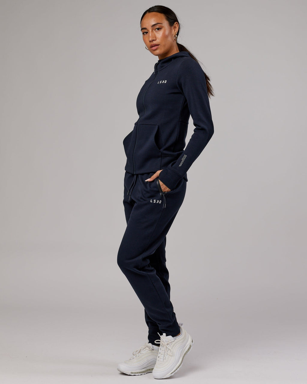 Model wearing Athlete ForgedFleece Zip Through Hoodie - Dark Navy