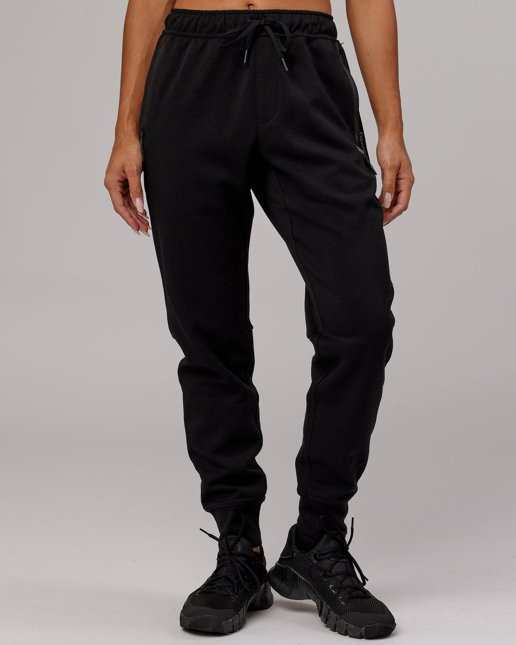 Model wearing Womens Athlete ForgedFleece Trackpant - Black