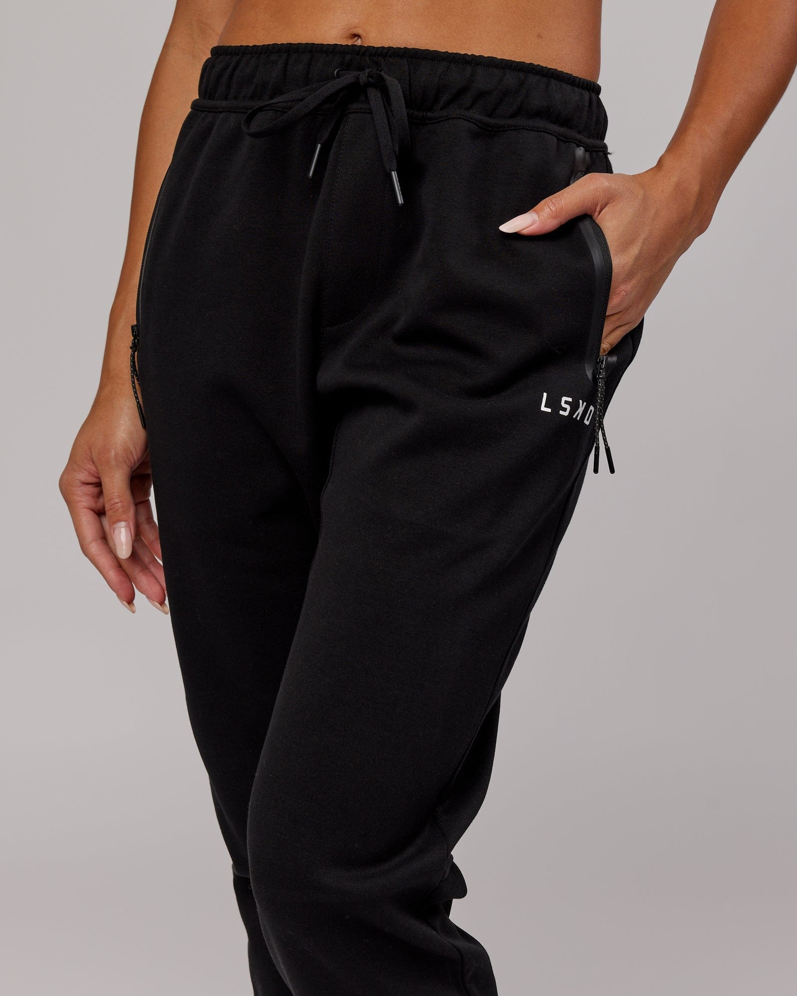 Model wearing Womens Athlete ForgedFleece Trackpant - Black
