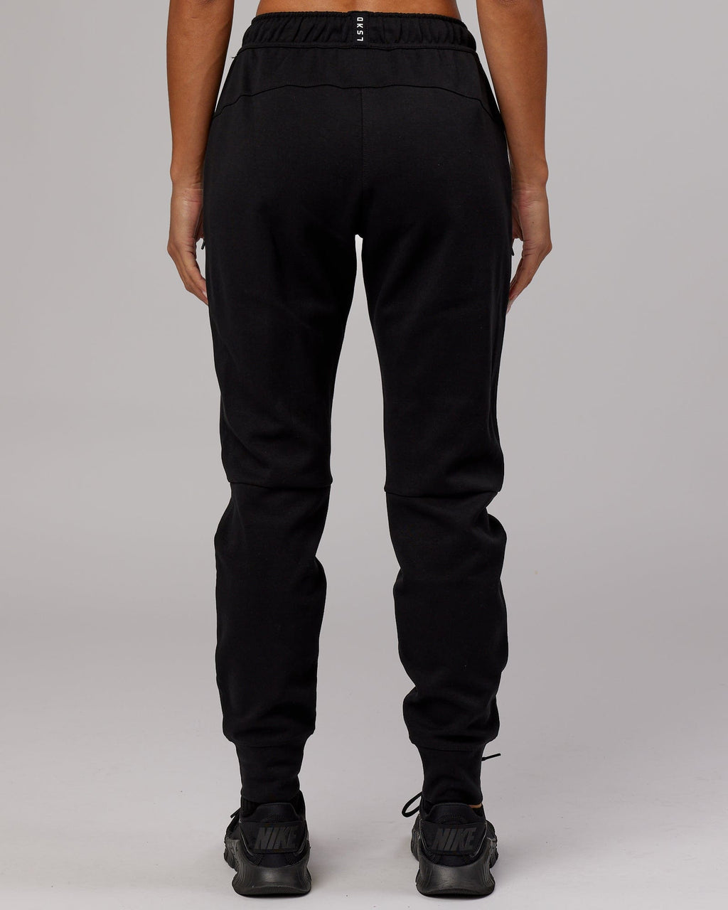 Model wearing Womens Athlete ForgedFleece Trackpant - Black
