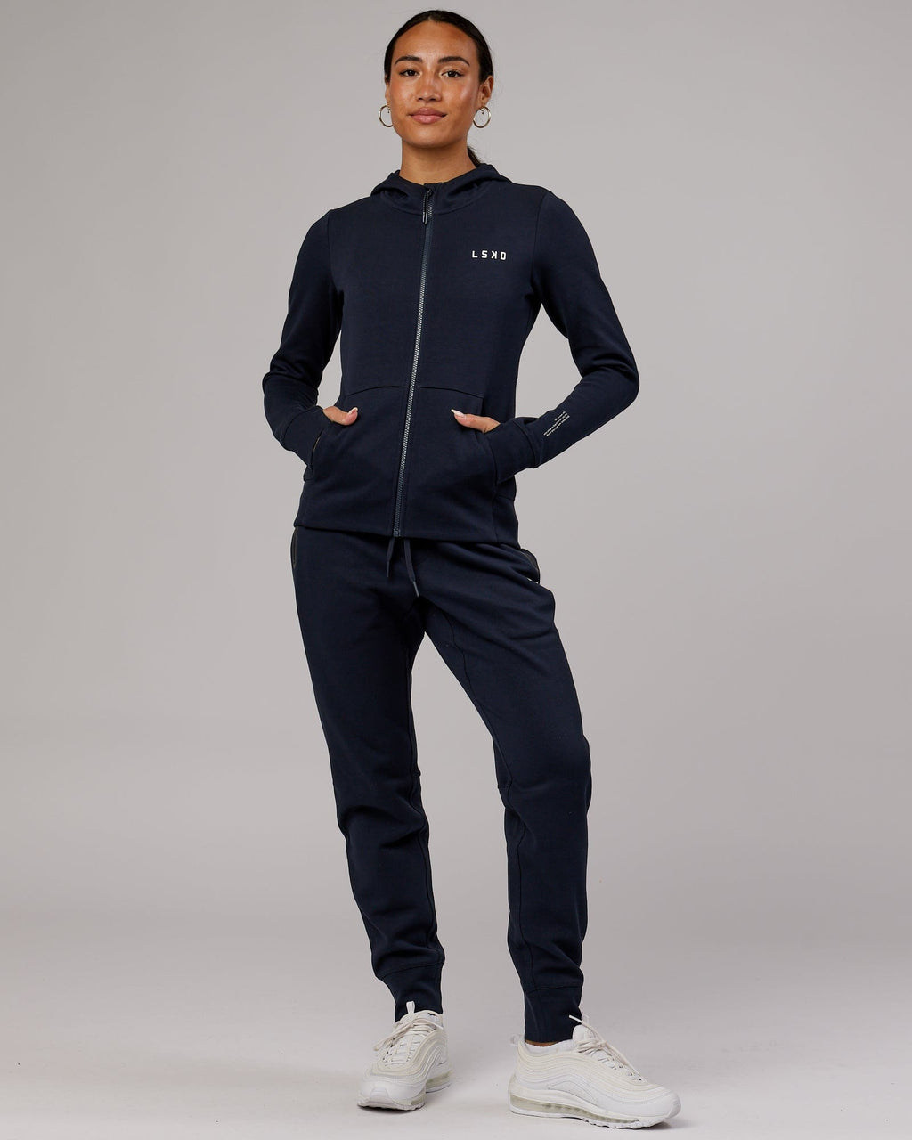 Model wearing Womens Athlete ForgedFleece Trackpant - Dark Navy