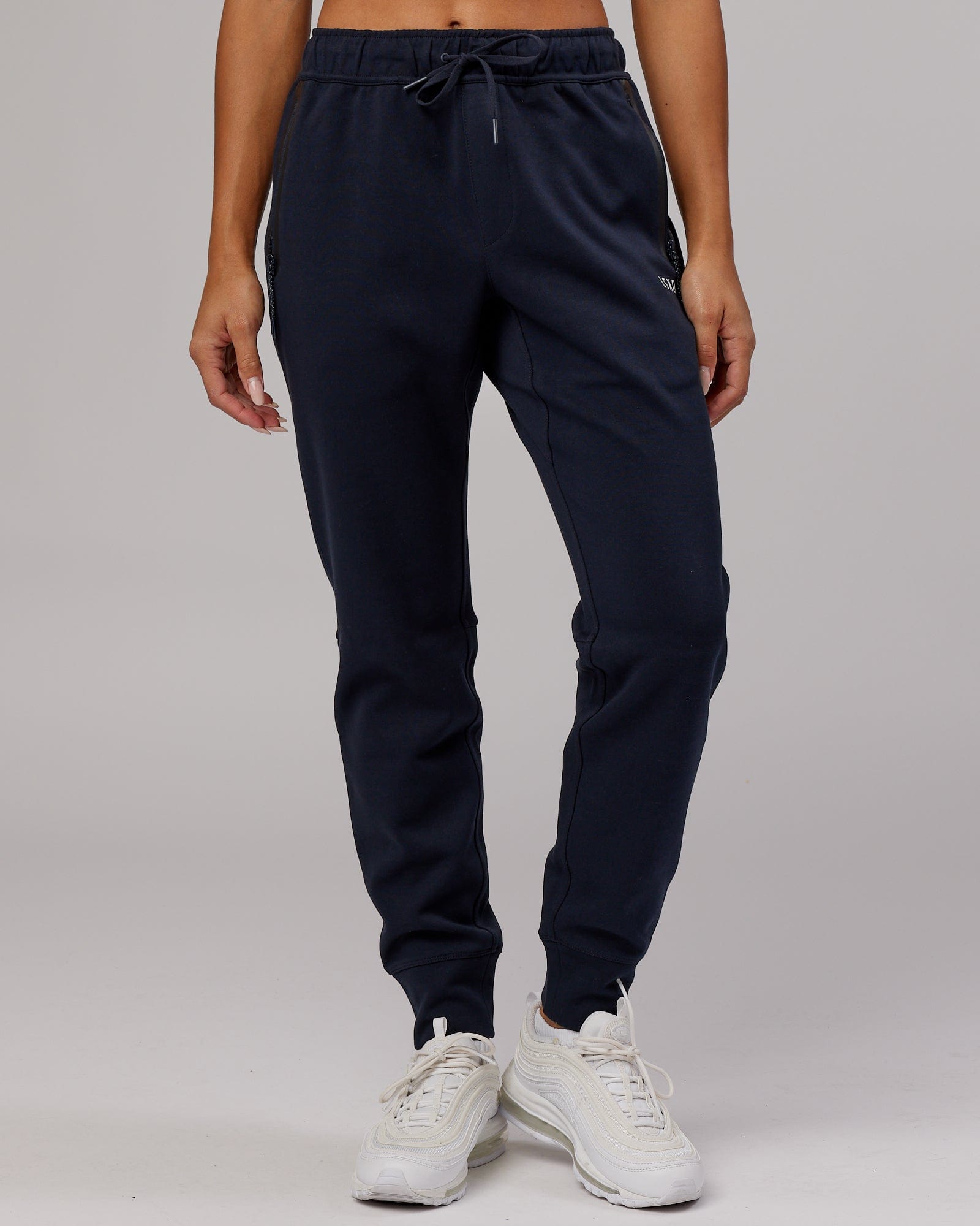 Model wearing Womens Athlete ForgedFleece Trackpant - Dark Navy