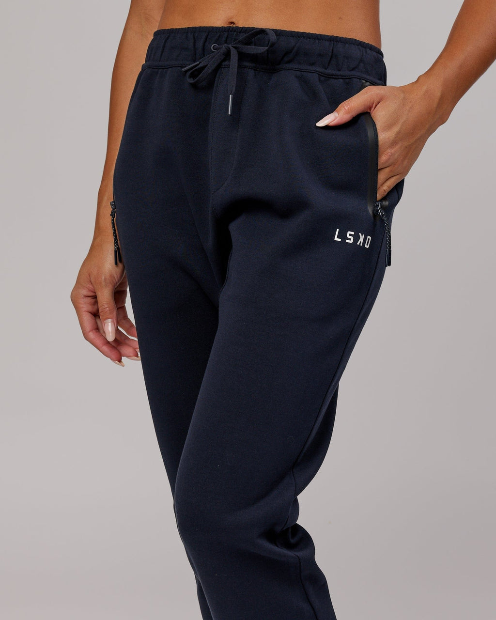 Model wearing Womens Athlete ForgedFleece Trackpant - Dark Navy