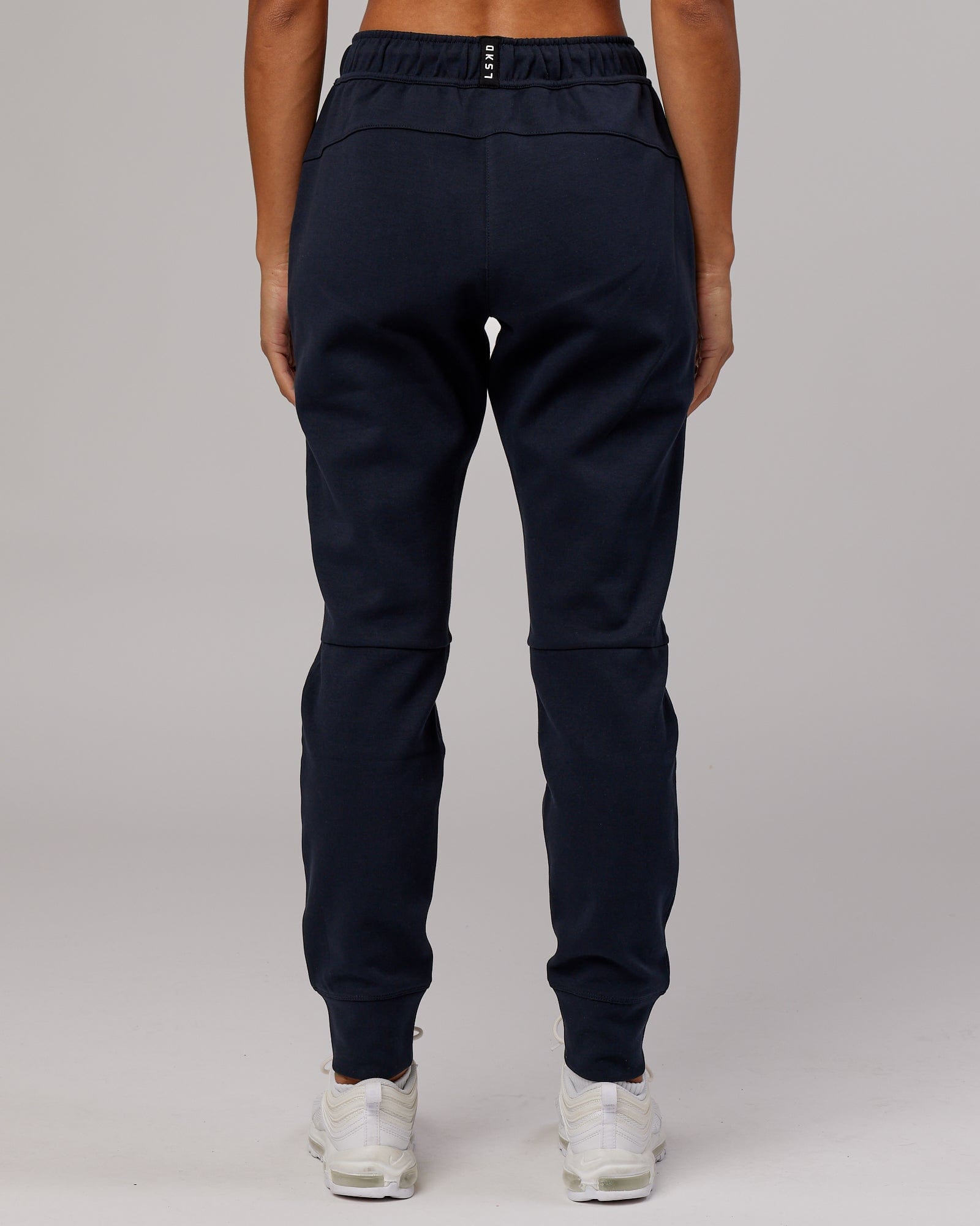 Model wearing Womens Athlete ForgedFleece Trackpant - Dark Navy