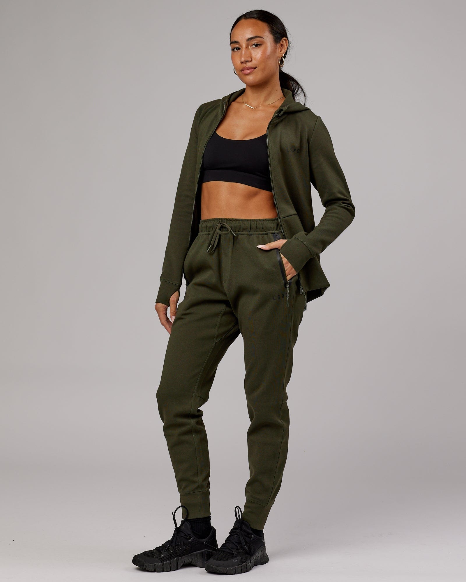 Model wearing Womens Athlete ForgedFleece Trackpant - Forest Night