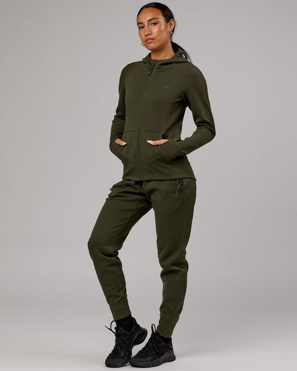 Model wearing Womens Athlete ForgedFleece Trackpant - Forest Night