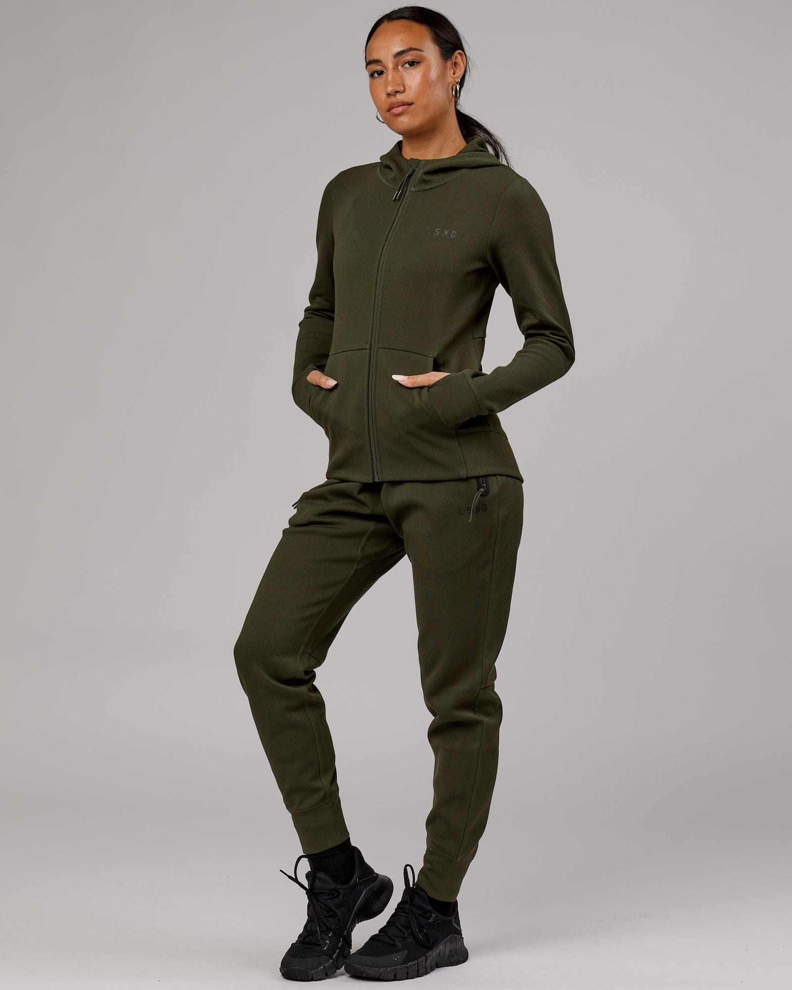 Model wearing Womens Athlete ForgedFleece Trackpant - Forest Night