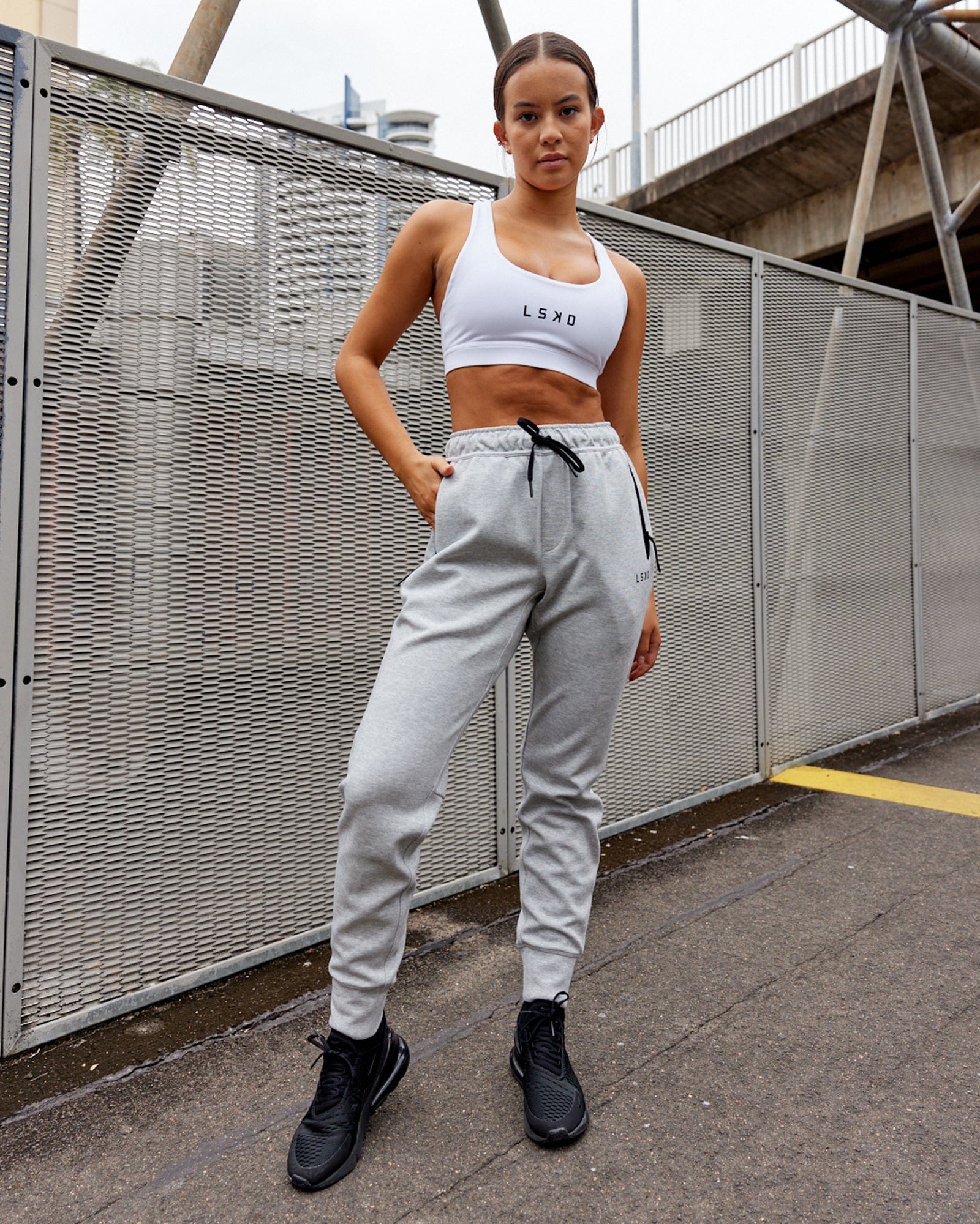 Model wearing Womens Athlete ForgedFleece Trackpant - Lt Grey Marl