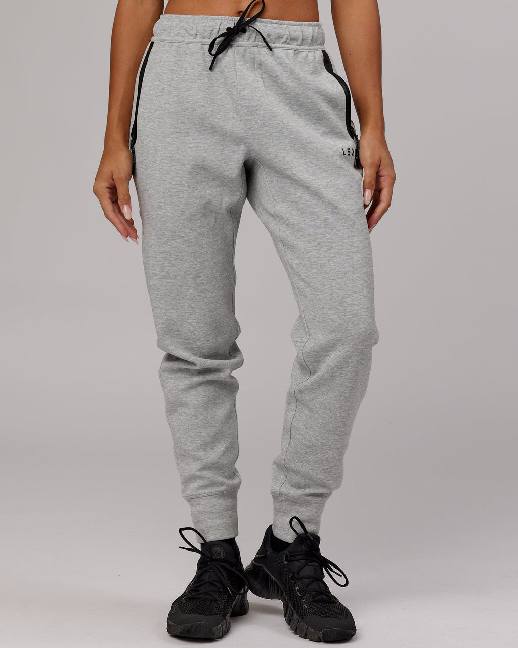 Model wearing Womens Athlete ForgedFleece Trackpant - Lt Grey Marl
