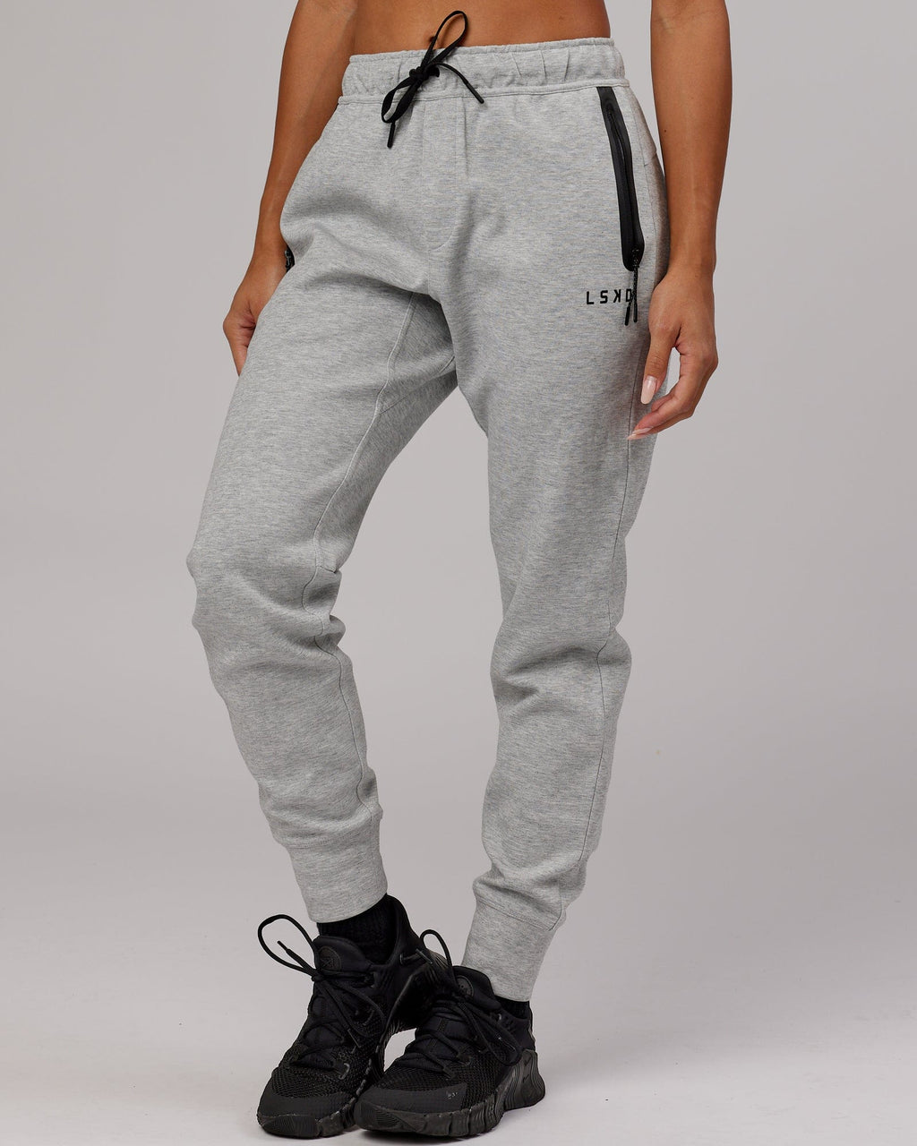 Model wearing Womens Athlete ForgedFleece Trackpant - Lt Grey Marl