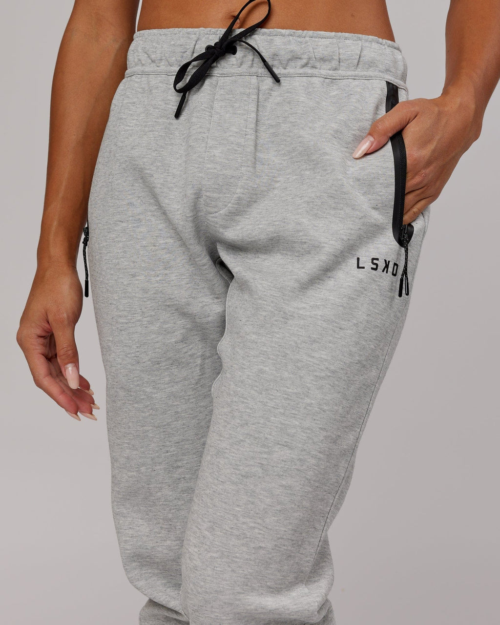Model wearing Womens Athlete ForgedFleece Trackpant - Lt Grey Marl