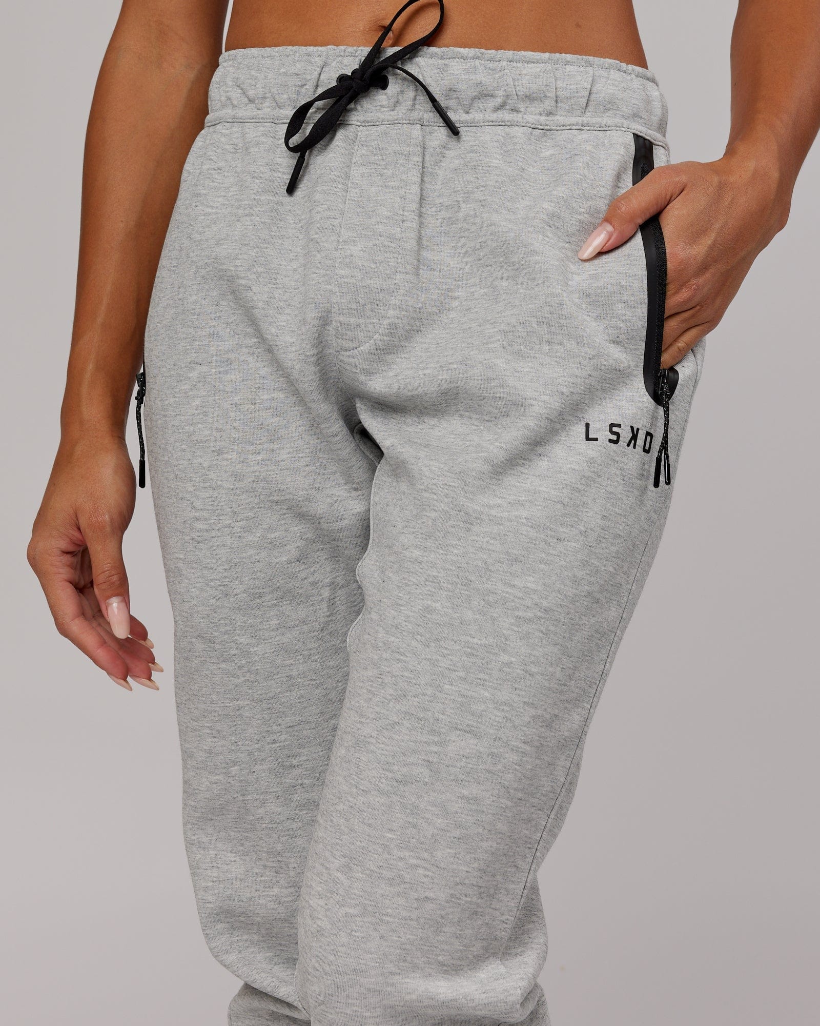 Model wearing Womens Athlete ForgedFleece Trackpant - Lt Grey Marl