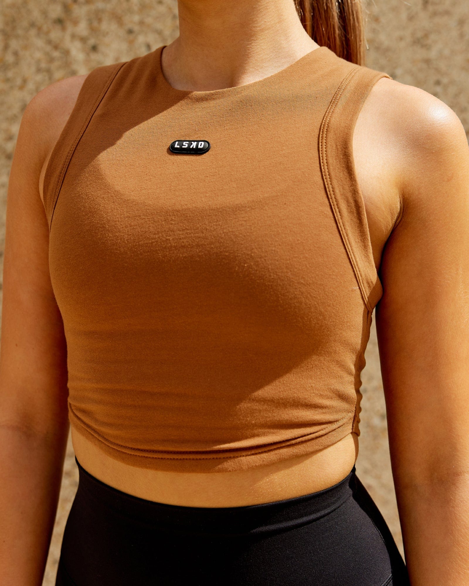 Model wearing Capsule Tank - Camel