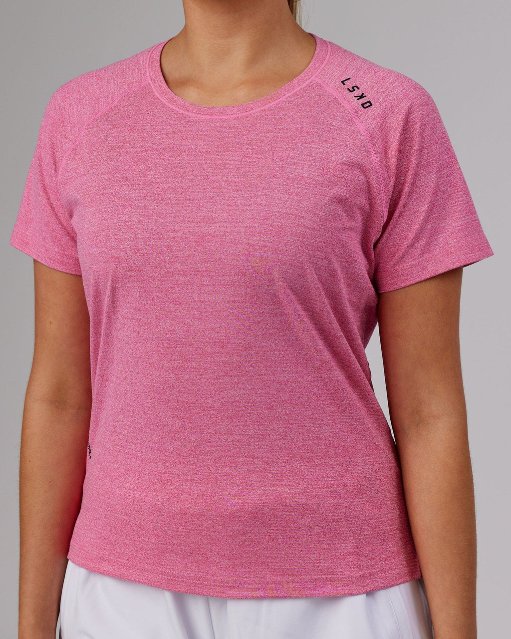 Model wearing Perform VapourFLX Tee - Magenta Marl