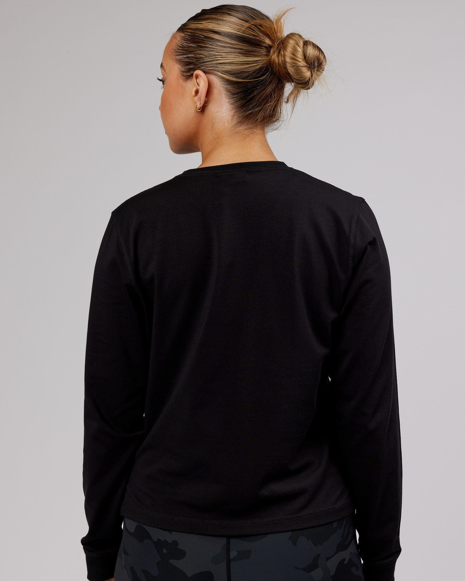 Model wearing Deluxe PimaFLX LS Tee - Black