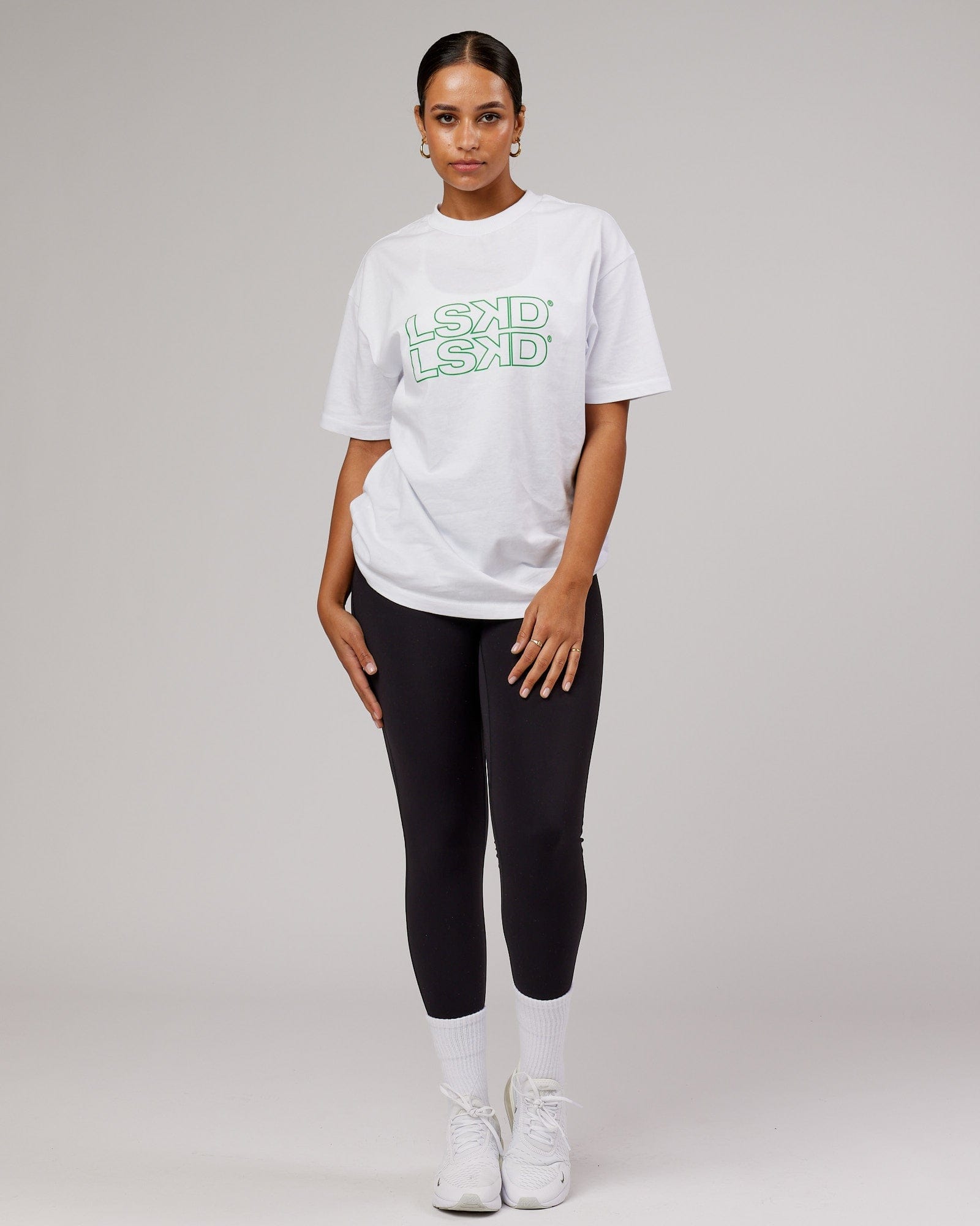 Model wearing Unisex Stacks Up Heavyweight Oversize Tee - White-Vivid Green