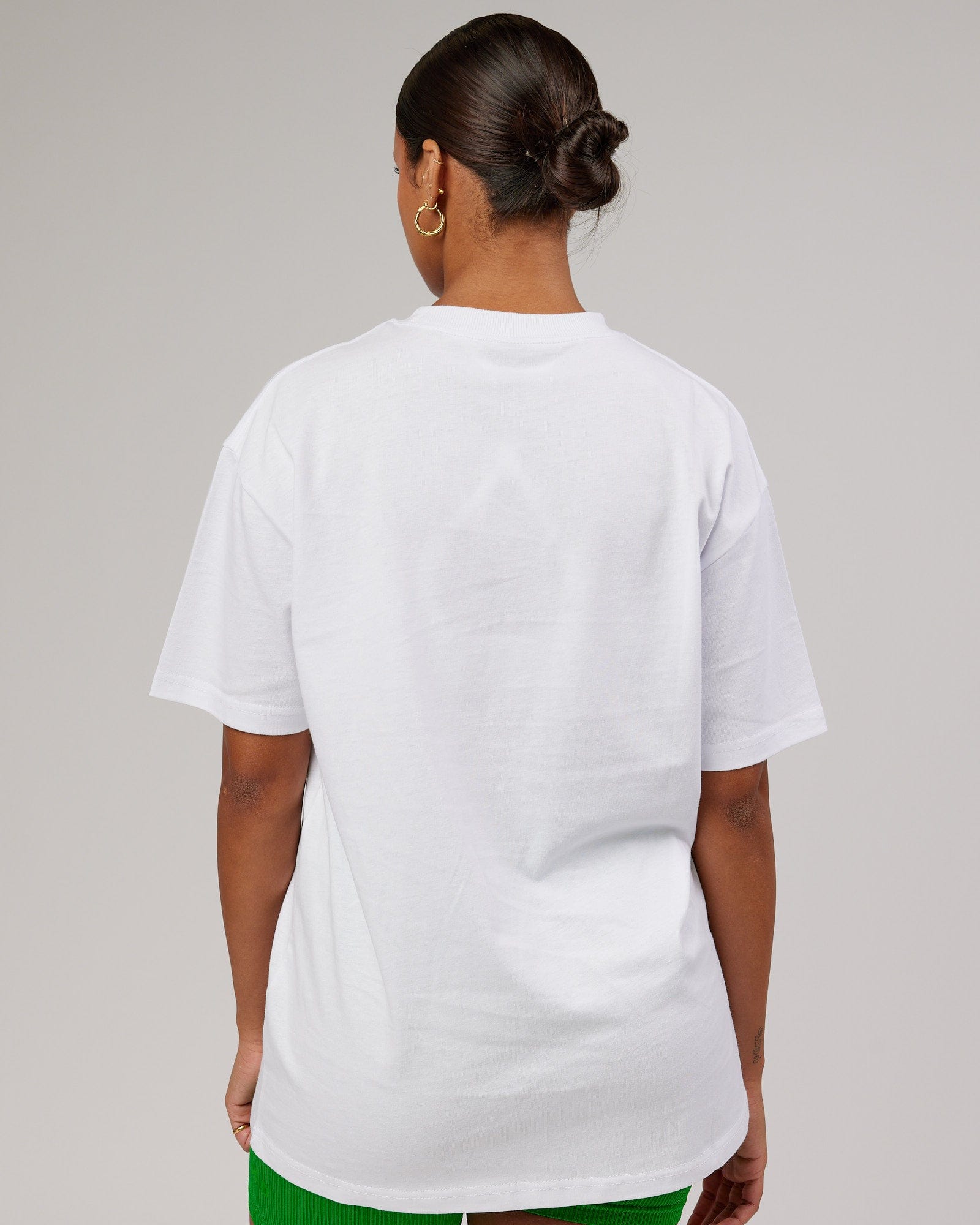 Model wearing Unisex Stacks Up Heavyweight Oversize Tee - White-Vivid Green